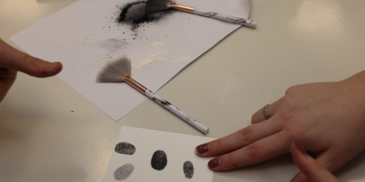 prospective students learning forensic investigation techniques